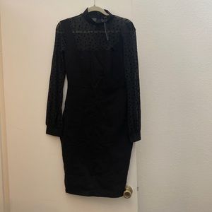 Sexy black turtle neck dress great for the office or happy hour